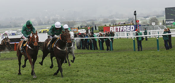 13.03.2015 - Cheltenham; Peace And Co ridden by Barry Geraghty (green cap) wins the JCB Triumph Hurdle Grade 1. Second place: Top Notch ridden by Daryl Jacob. Credit: Lajos-Eric Balogh/turfstock.com