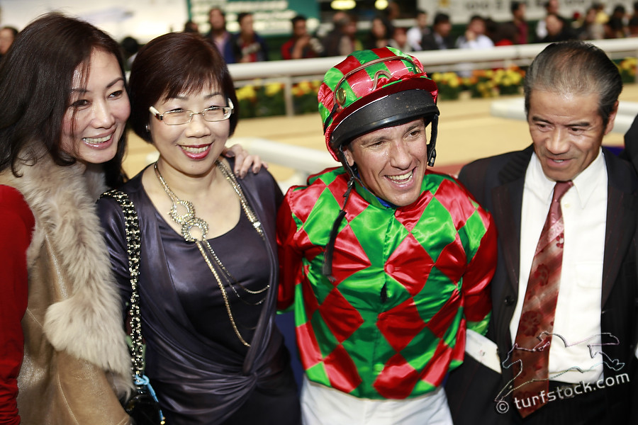 07. Dec. 2011 - Happy Valley Racecourse; Winners presentation with Lanfranco Dettori and Trainer Tony Cruz (right) after winning the final leg from the Cathay Pacific International Jockey Championship with Regency Winner. Credit: Lajos-Eric Balogh/turfstock.com