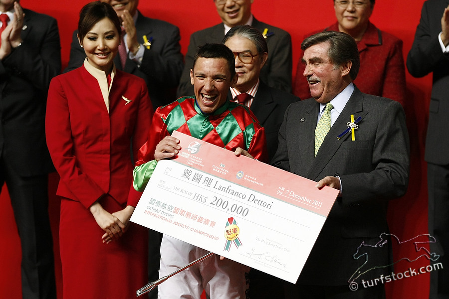 07. Dec. 2011 - Happy Valley Racecourse; Lanfranco Dettori receives his check after winning the Cathay Pacific International Jockey Championship. Credit: Lajos-Eric Balogh/turfstock.com